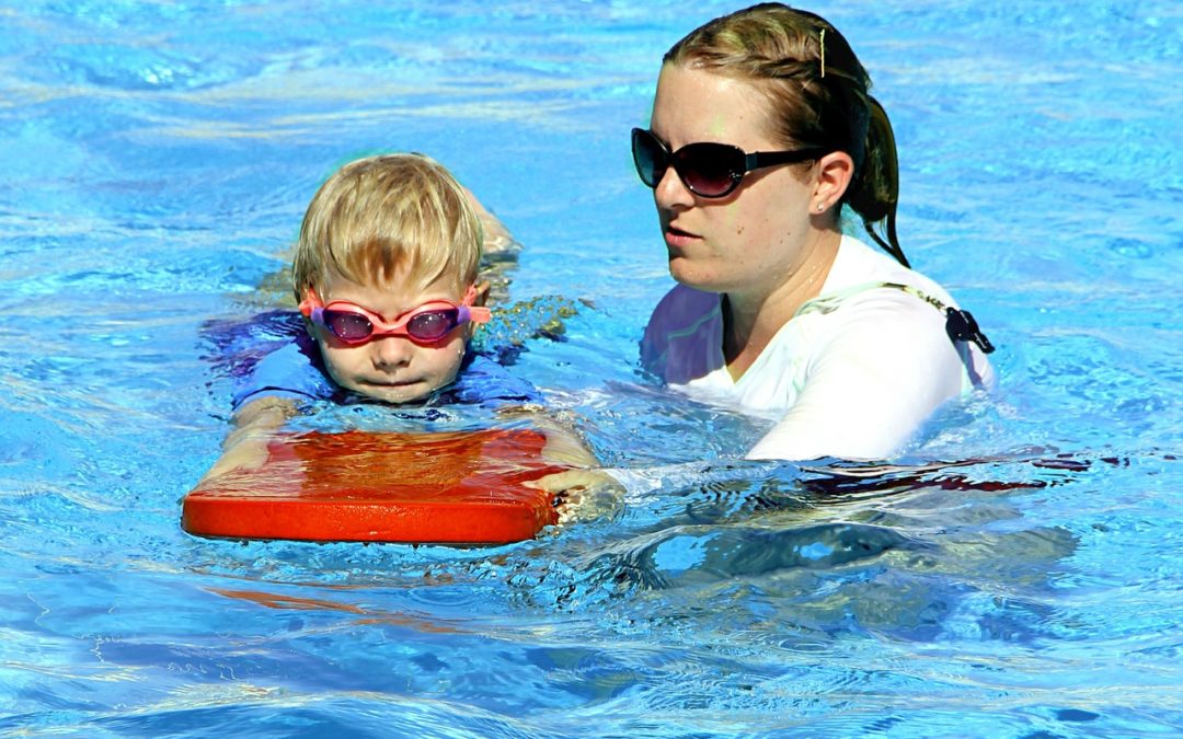 child in swim safety class